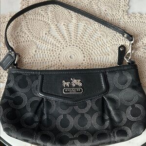 Vintage Coach Handbag with Coach Logo and detachable strap.
